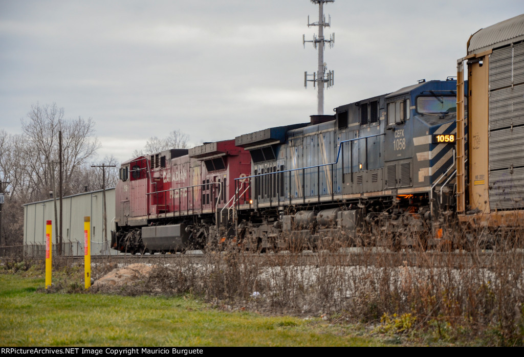 CP + CEFX AC44CW Locomotives leading a train